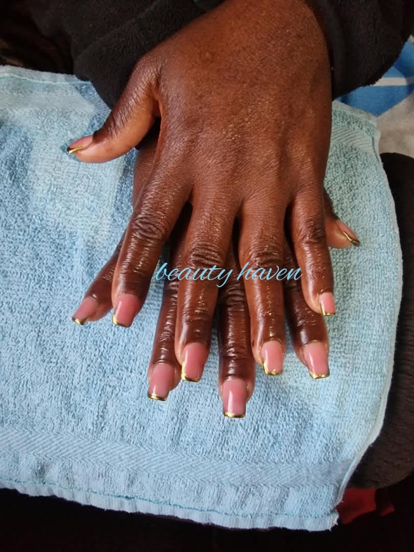 Clear gel nail extensions in progress at Saylor Beauty Spa
