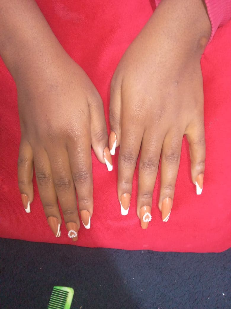 Close-up of hand-painted gel nail art at Saylor Beauty Spa
